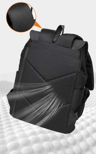 Detail of breathable honeycomb mesh back panel and padded straps on black business backpack