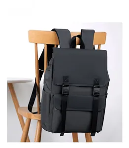 Detail of dark grey waterproof business backpack with dual buckle closure and flap design