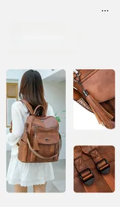 Detail view of brown PU leather backpack with tassel charms and patterned strap