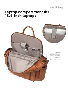 Detail of 15.6 inch laptop compartment with velcro strap in brown PU backpack