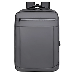 Minimalist grey business laptop backpack with USB charging port and waterproof fabric
