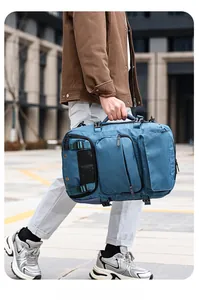 Detail of blue water-resistant nylon travel backpack with reinforced handles and multi-pockets