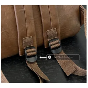 Close-up of adjustable brown shoulder strap and buckle on the leather backpack