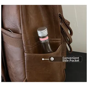 Detailed side pocket view of dark brown PU leather backpack for storage