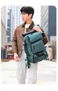 Detail of teal travel backpack showing reinforced side handle and adjustable buckle straps