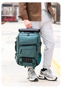 Detailed teal travel backpack with multi-layer zipper pockets and side buckles