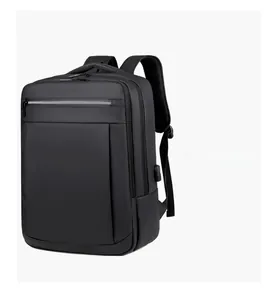 Minimalist black business backpack featuring a USB charging port and waterproof fabric