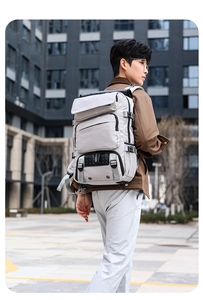 Detail of multi-functional travel backpack featuring layered zippers and durable buckles