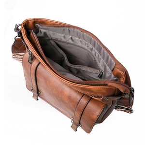 Brown faux leather bucket bag with large capacity interior and decorative buckle details