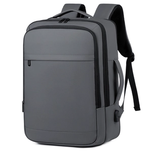 Gray business laptop backpack with USB port and multiple compartments for travel use