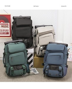 Group shot of multi-color travel backpacks in black, beige, teal, and blue