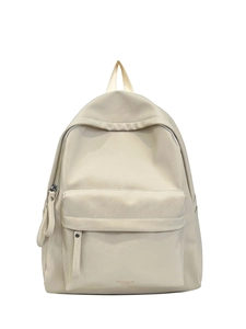 Close-up of cream PU leather backpack featuring litchi grain texture and front zip pocket