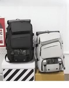 Front view of black and grey roll-top backpacks with multiple pockets for travel