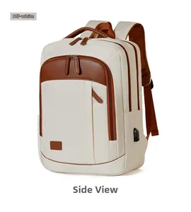 Detail of a beige business backpack featuring a USB charging port and brown leather pulls