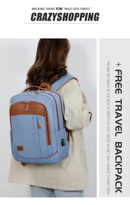 Detail view of business backpack featuring built-in USB charging port and brown leather trim