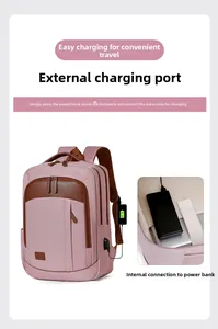 Pink laptop backpack featuring an external USB charging port and internal power bank pocket
