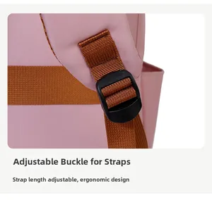 Detail of adjustable strap buckle and pink nylon fabric on a business travel backpack