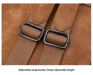Macro detail of adjustable shoulder strap buckle on a vintage brown suede backpack