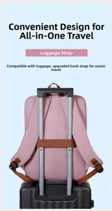 Pink travel backpack with a brown luggage strap for secure attachment to suitcases