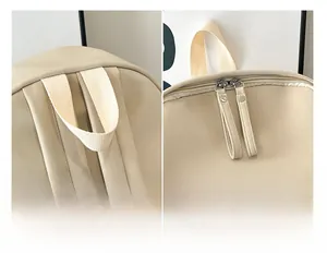 Detailed close-up of beige PU leather backpack with soft handle and double zipper pulls