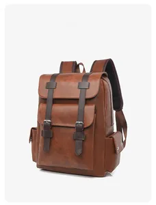 Detail view of the vintage brown 15-inch laptop backpack with leather texture and straps