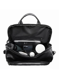 Internal view of minimalist PU leather backpack showing large capacity and inner pockets