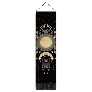 Detail of sun and moon tapestry with gold screen printing and black fringe tassels