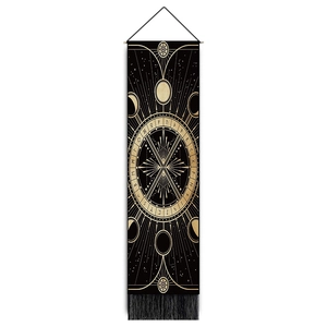 Detail of sun god tapestry showing lunar phases and runes with black fringe and wooden bar
