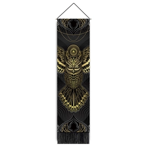 Detailed view of owl wall hanging with golden mandala pattern and black fringe tassels
