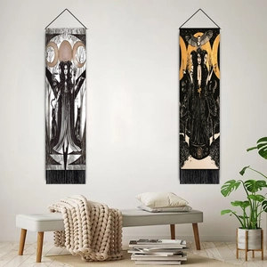 Set of two moon eclipse gothic wall tapestries with tassels in a cozy room setting