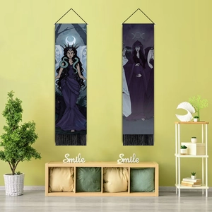 Detail of lunar eclipse mystical tapestries with black tassels on a green wall