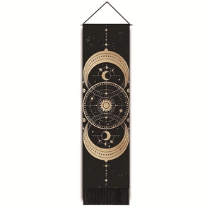 Detailed view of black bohemian tapestry with golden moon phases and star chart fringe