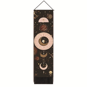 Detailed shot of bohemian moon phase tapestry with stars and black decorative tassels
