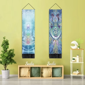 Detail of meditation tapestries featuring seven chakras and Om symbols with black tassels