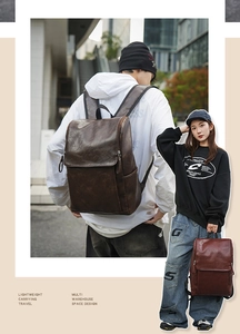 Detailed view of vintage brown leather backpack with multiple storage pockets for travel