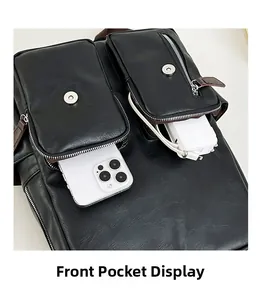 Makroansicht der Vordertaschen mit Magnetverschlüssen und Metallzippern am schwarzen Rucksack
