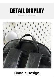 Detail of the reinforced handle and textured faux leather on the black commuter backpack