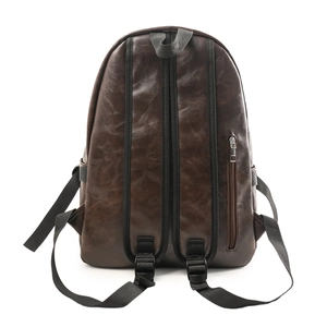 Rear view of brown PU leather backpack with lychee texture and black nylon straps