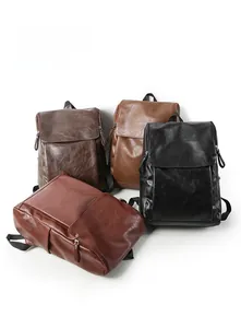 Detail view of retro synthetic leather backpacks in black, brown, and coffee tones