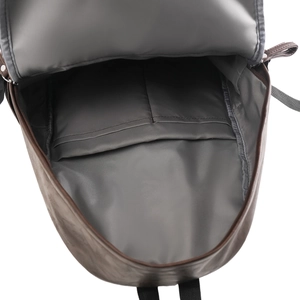 Top-down view showing interior storage with two open pockets and grey lining of the backpack