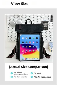 Detail view of large black pebble leather backpack compared to a tablet for size reference