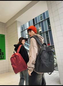 Macro detail of the durable nylon fabric with plaid pattern on these casual backpacks