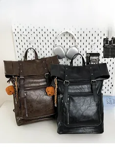 Detail showing vintage PU leather backpacks with flap buckles and cute bear charms