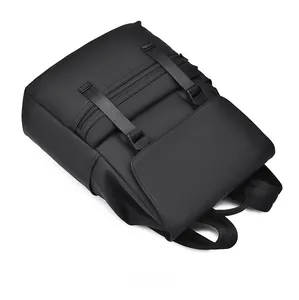 Top view of matte black waterproof backpack showing zipper and nylon adjustment straps