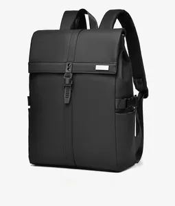 Detail of waterproof matte black backpack featuring roll-top closure and side buckle straps