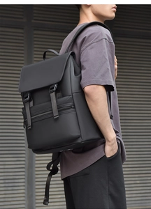 Side view of black minimalist waterproof backpack with matte texture and dual buckle straps