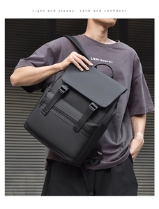 Detail of waterproof matte black travel backpack with buckle straps and side pockets