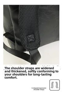 Detail of S-shaped ergonomic shoulder straps with breathable mesh on black leather backpack