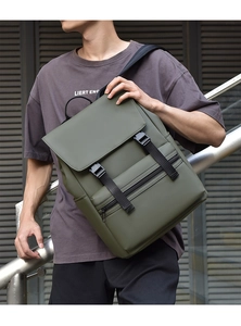 Close-up of olive green urban backpack with dual buckle closure and matte waterproof fabric