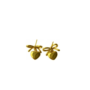Elegant gold bow and heart stud earrings with a polished finish on white background